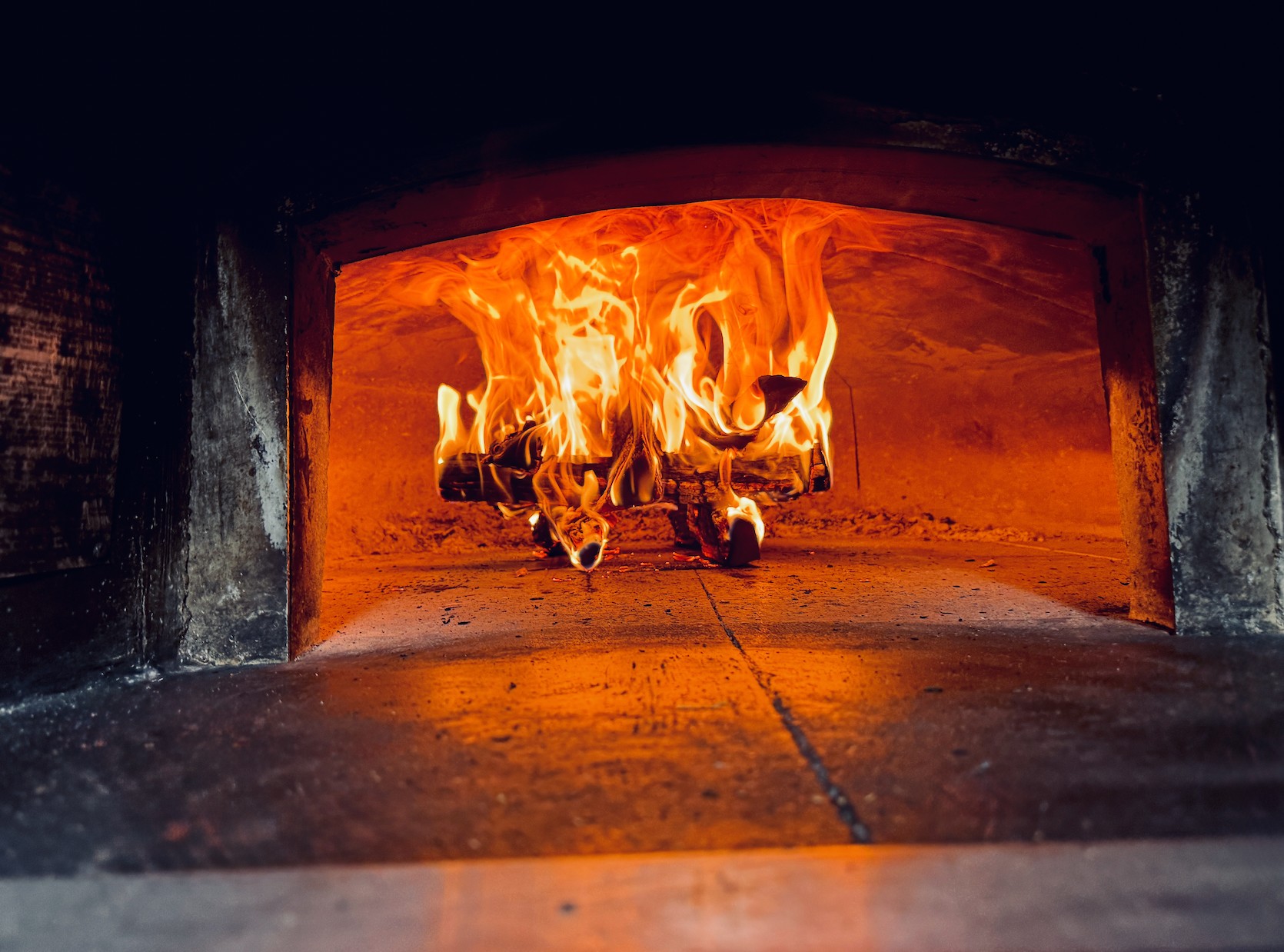 Live fire inside the wood-fired oven